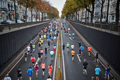 people running on road during daytime
