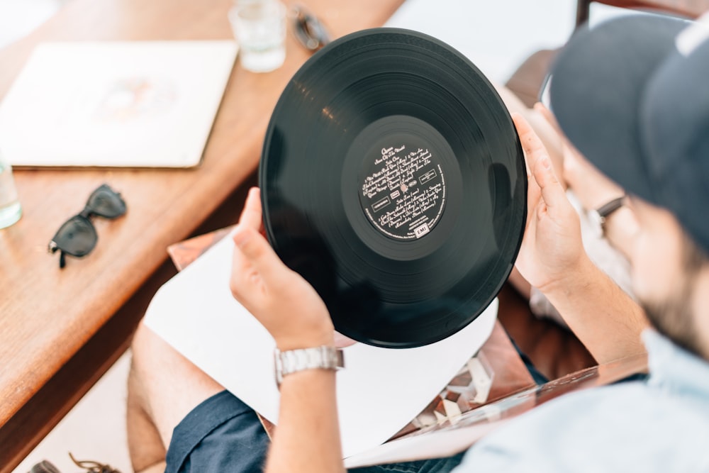 man holding vinyl record