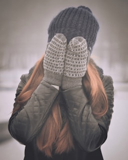 woman covering her face