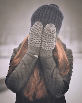 woman covering her face