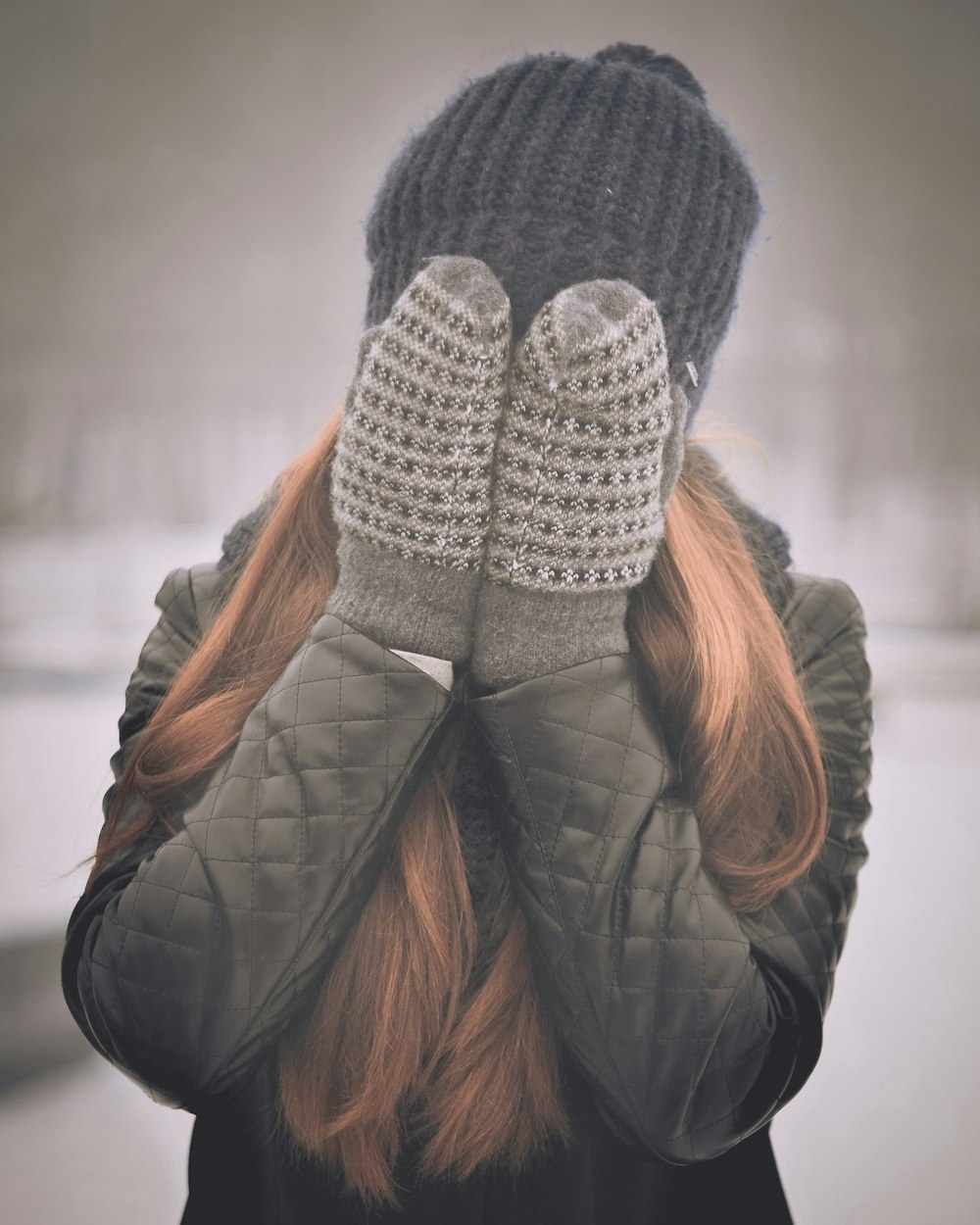 woman covering her face