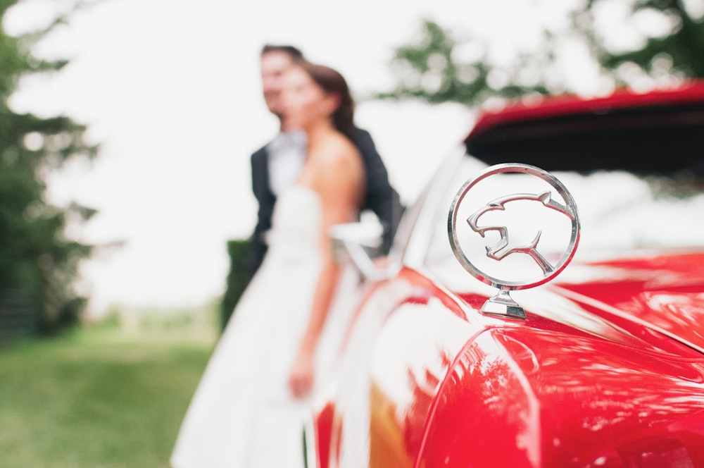 shallow focus photography of Jaguar car emblem