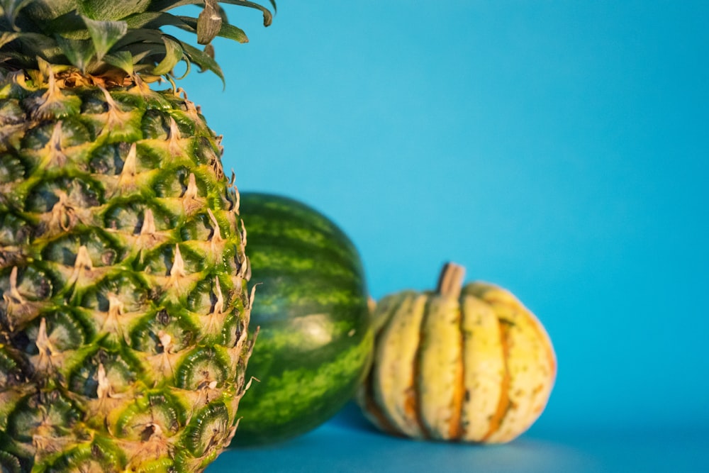 close-up photo of pineapple, watermelon, and squash