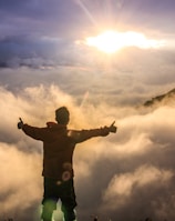 man facing clouds during golden time