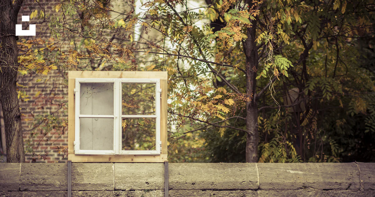 White and brown 4-pane window on gray concrete fence photo – Free ...