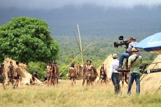 man wearing green t-shirt and blue jeans