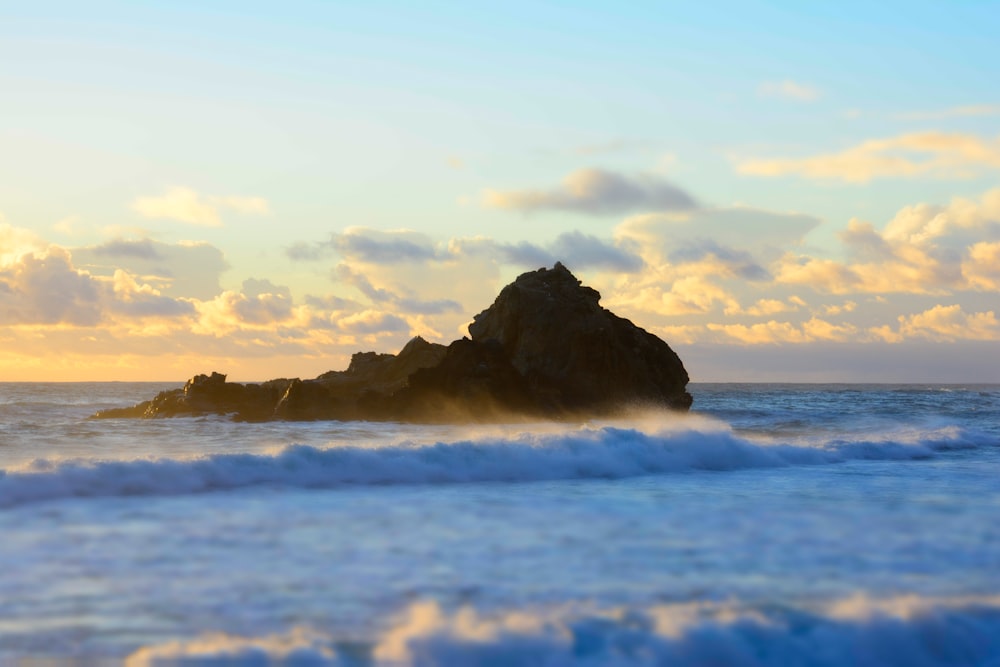 rock formation on body of water