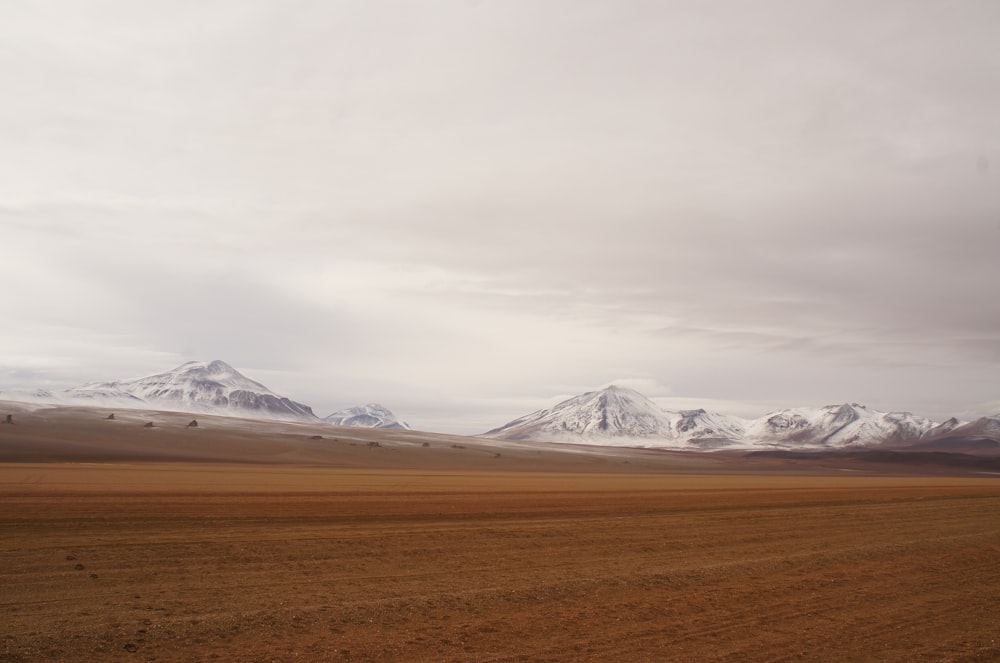 white mountains under gray sky during day