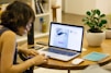 woman browsing on her laptop