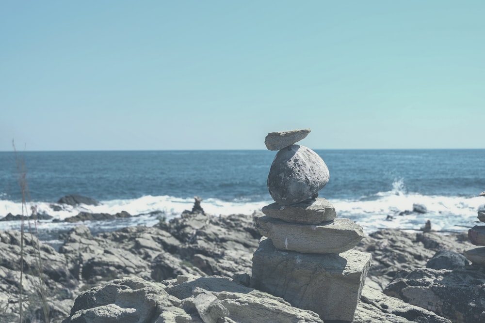 gray stone formation on beach