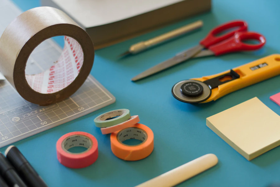Neatly arranged craft supplies — tape, scissors, and washi rolls