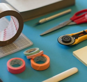 assorted-color office items on table