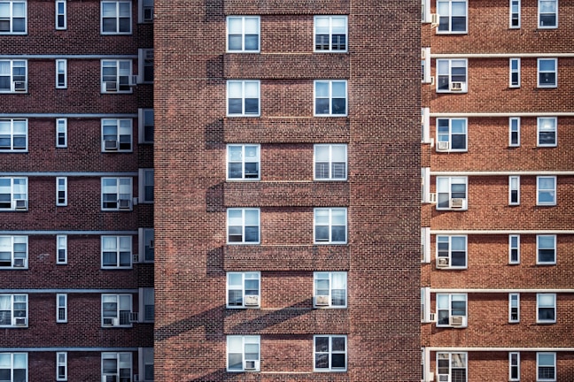 brown brick high-rise building