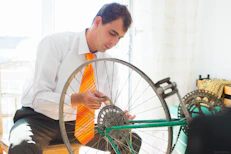 man holding sprocket