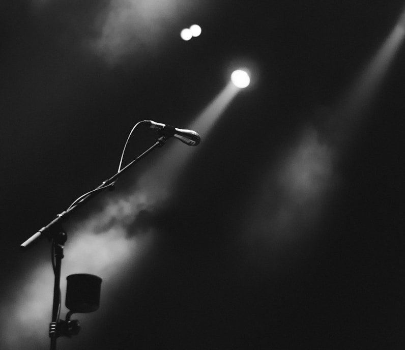 photo of microphone on foggy stage