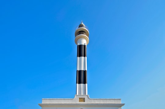 white and black concrete building under clear blue sky in Minorca Spain