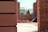 Close-up of a bricklayer carefully laying bricks on a construction site.