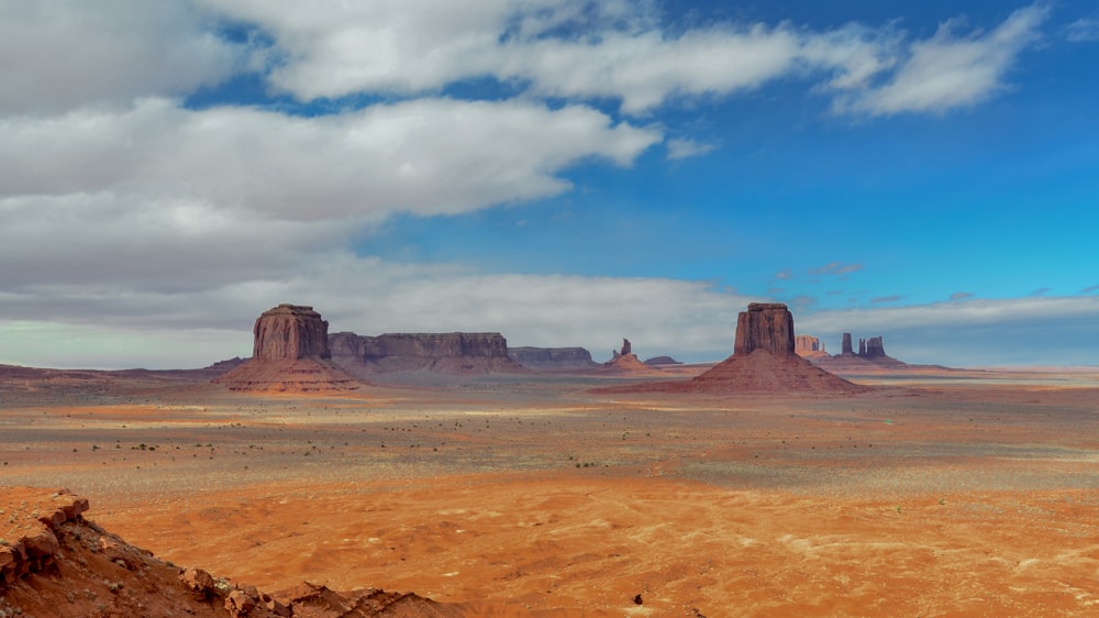 aerial photography of rock formation under cloudy sky