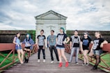 A group of diverse young adults showcasing modern streetwear.
