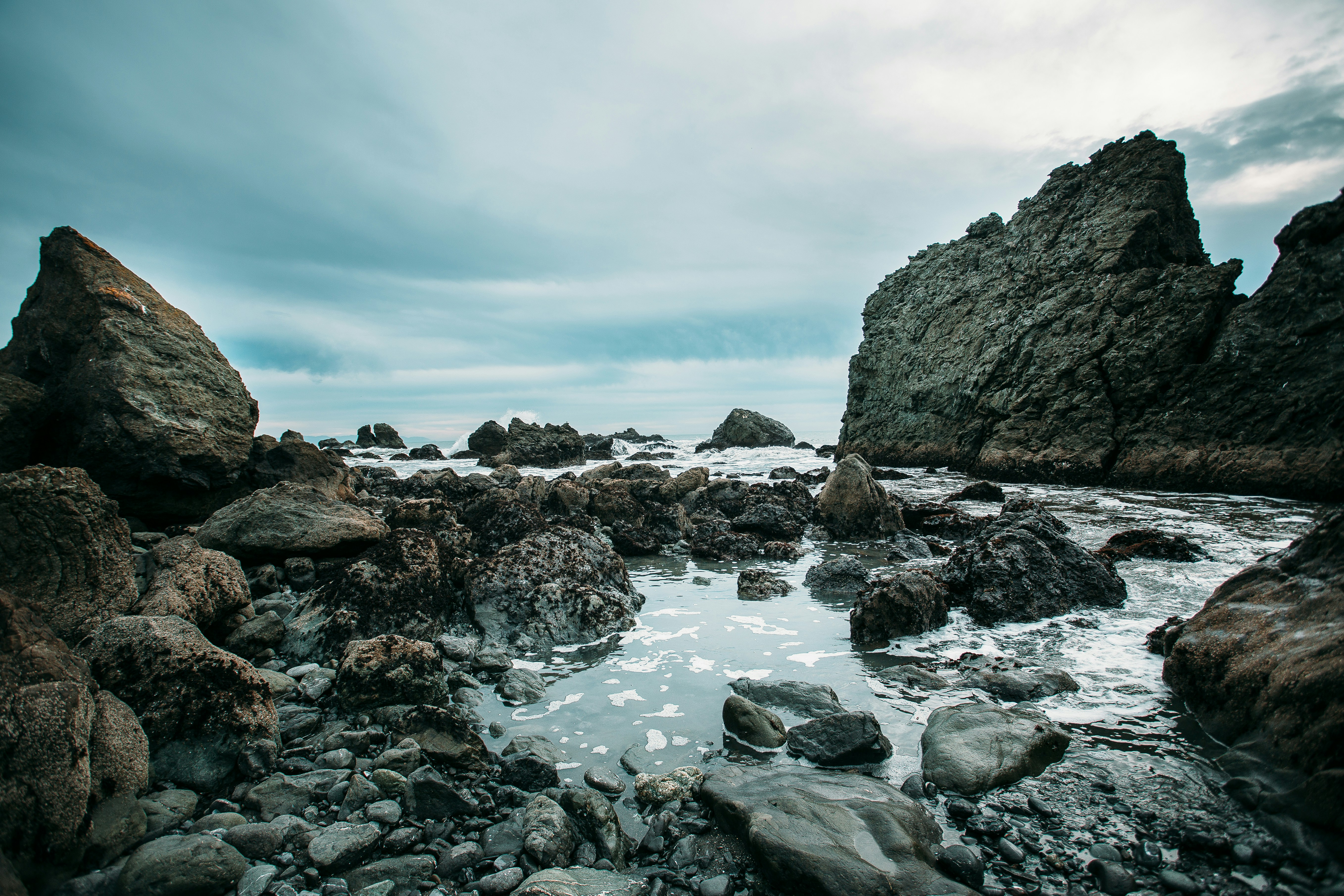 rocks near body of water, Rocky coastal lagoon