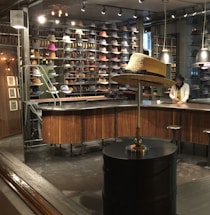 A cozy shop counter with various stylish caps displayed neatly.