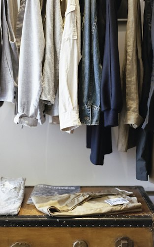 Close-up of folded garments and fabric texture on a clothing rack