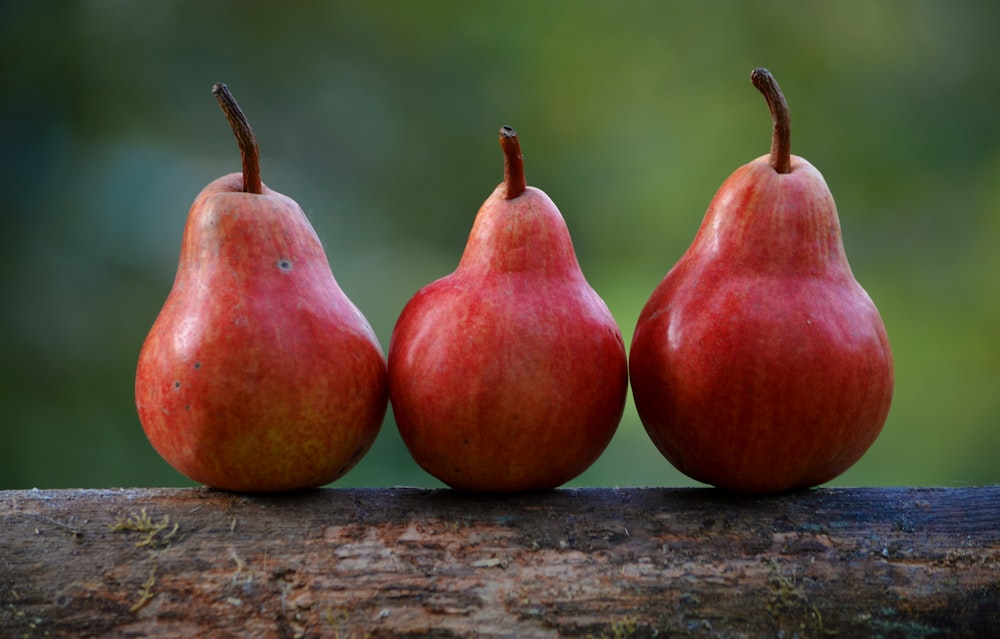 three red pear fruits