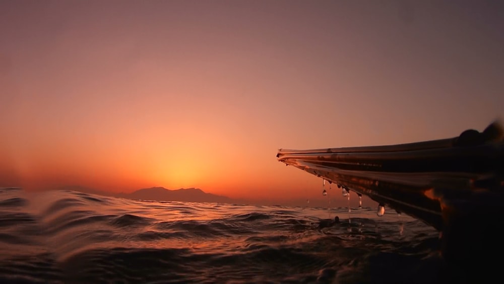 silhouette of boat and water