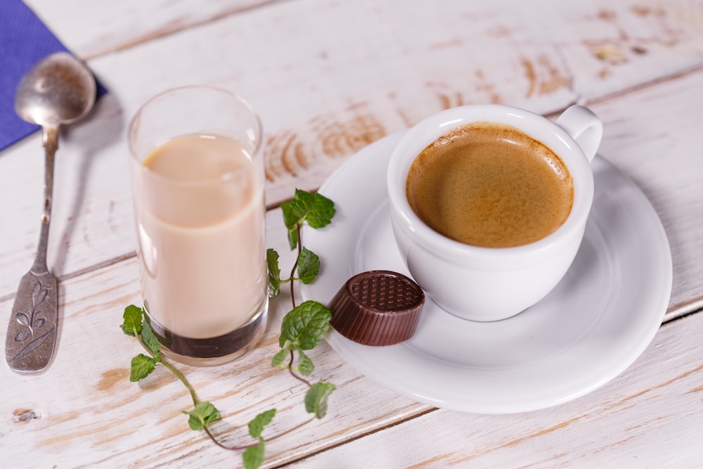 white ceramic teacup set and glass of milk on table