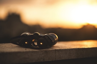 close-up selective focus photo of black binoculars