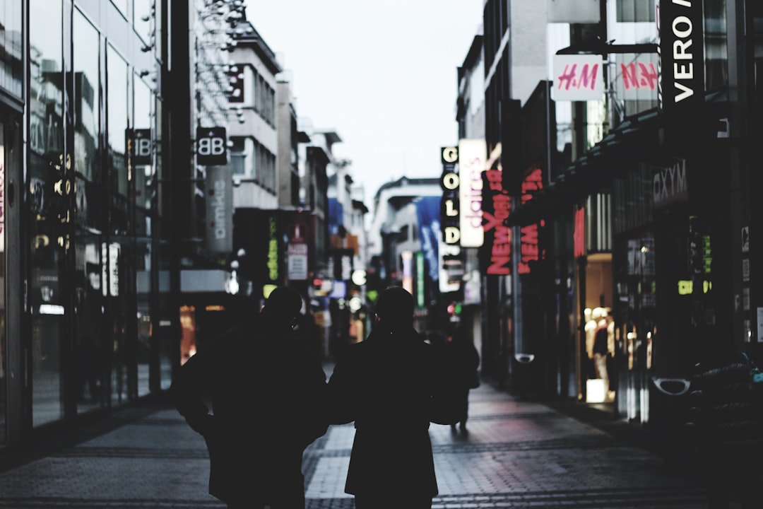 people walking on road,