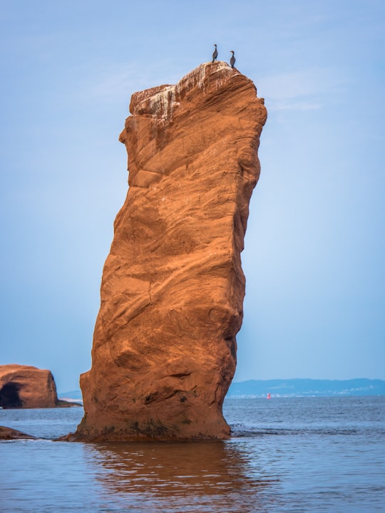 rock formation on body of water in Les Îles-de-la-Madeleine Canada