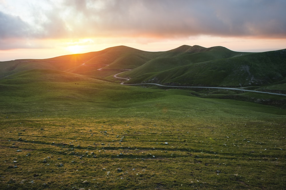 green mountain during sunset