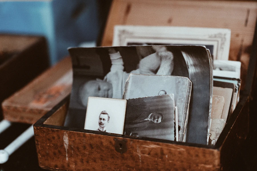 An old photograph laid out on a work table