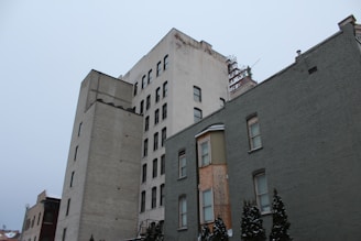 A collage of multi-family apartment buildings showcasing different architectural styles.