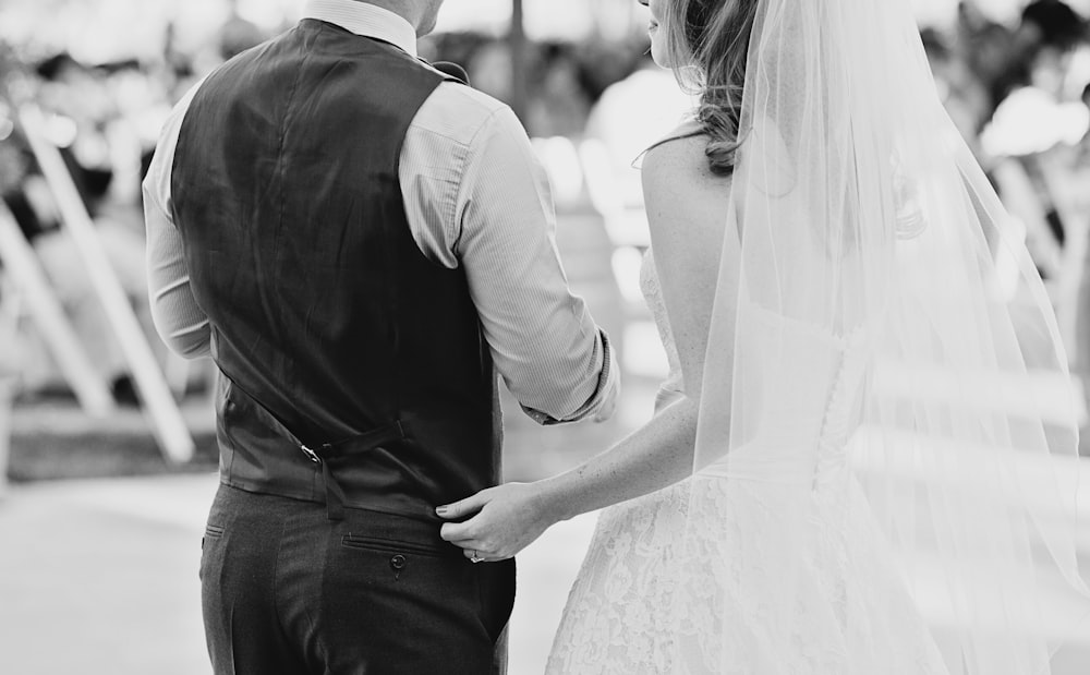 grayscale photography of bride and groom