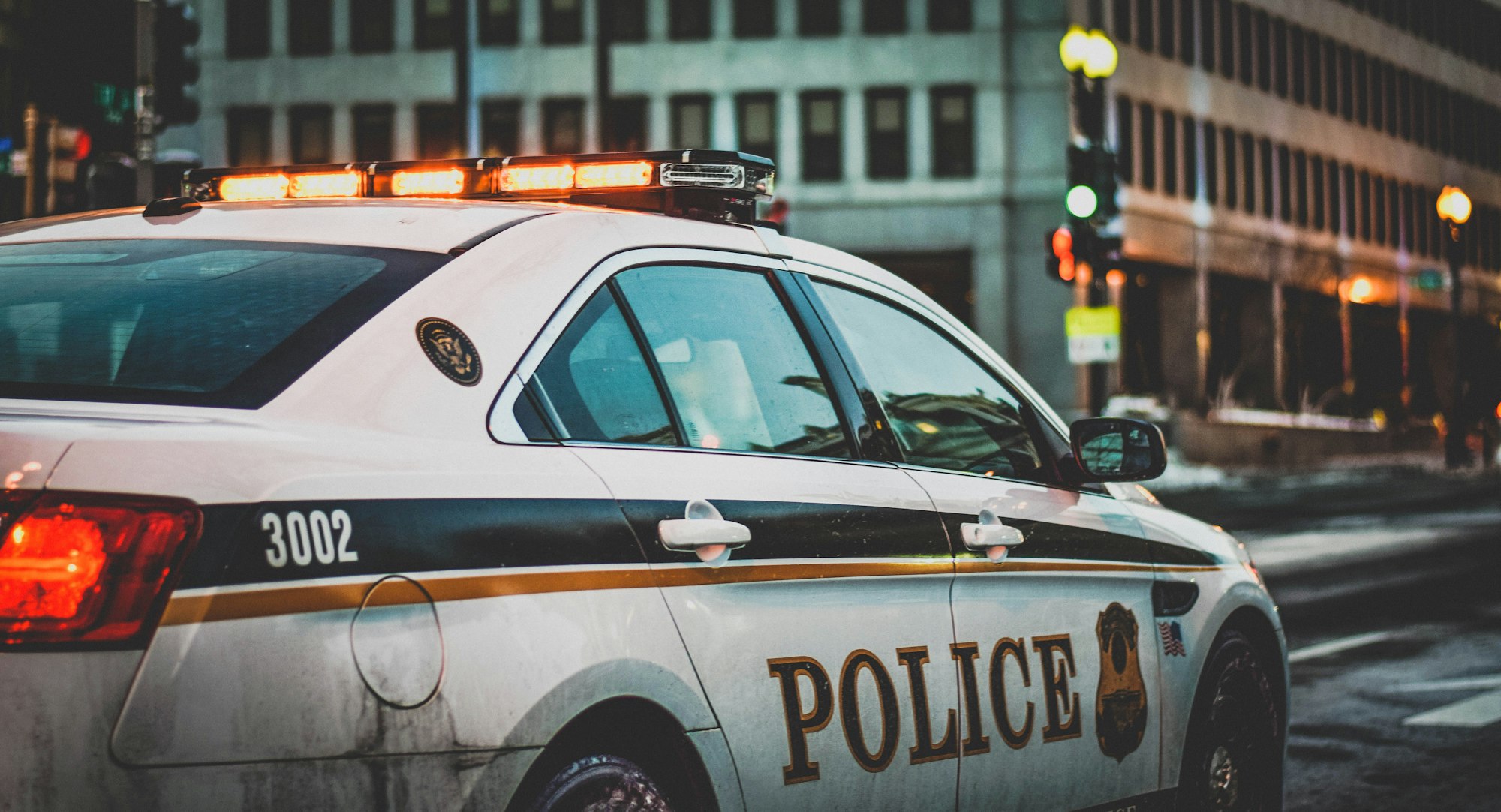 A police car belonging to the United States Secret Service Uniformed Division patrols a street adjacent to the White House in Washington, DC.