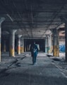 man walking hallway during daytime