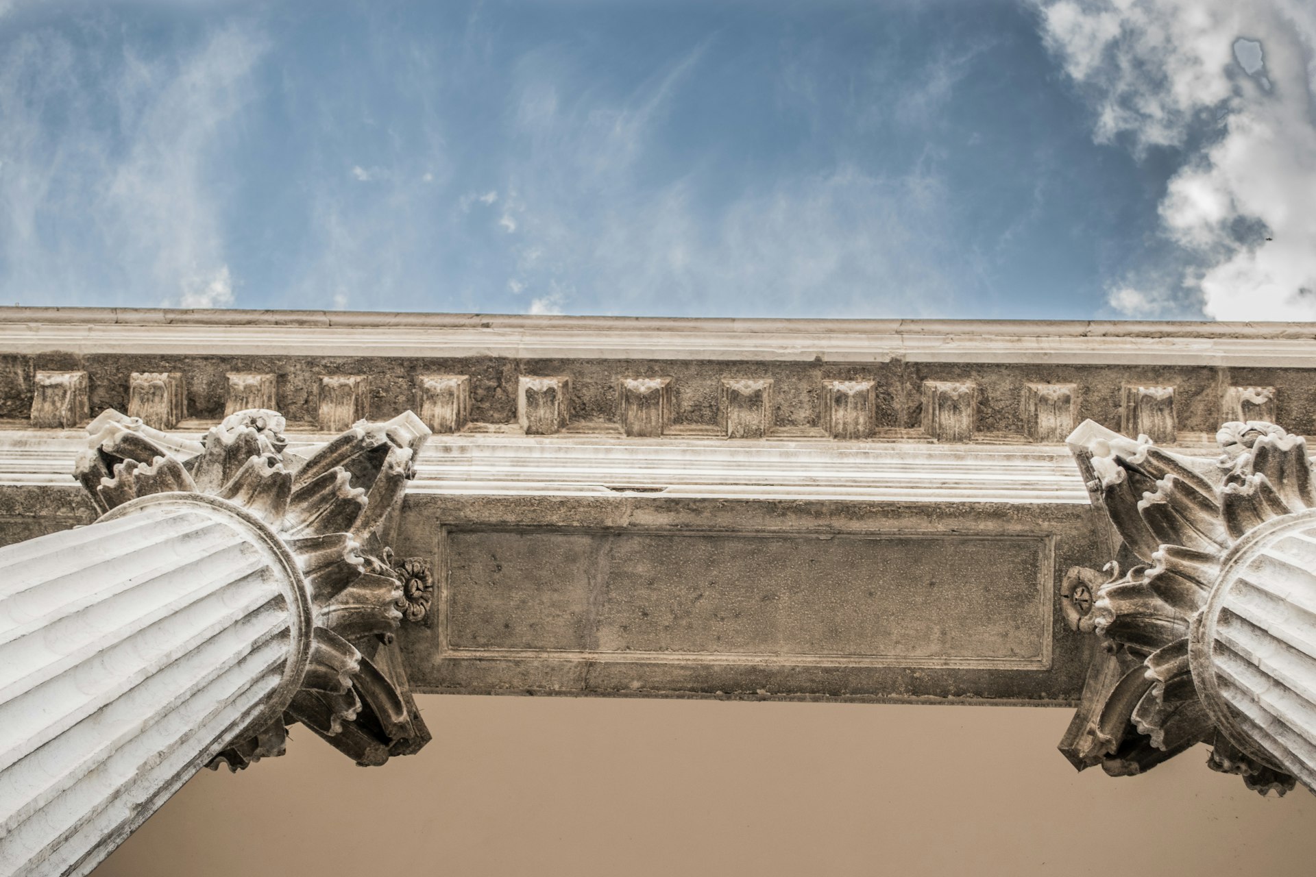 Classical stone column capitals on a courthouse facade