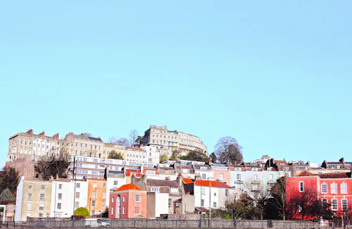 Rows of brightly painted terraced houses in a Bristol neighbourhood, useful context when using Bristol dating sites free of charge by area