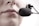 A close-up of a person's lips speaking into a black microphone headset, suggesting communication or recording.