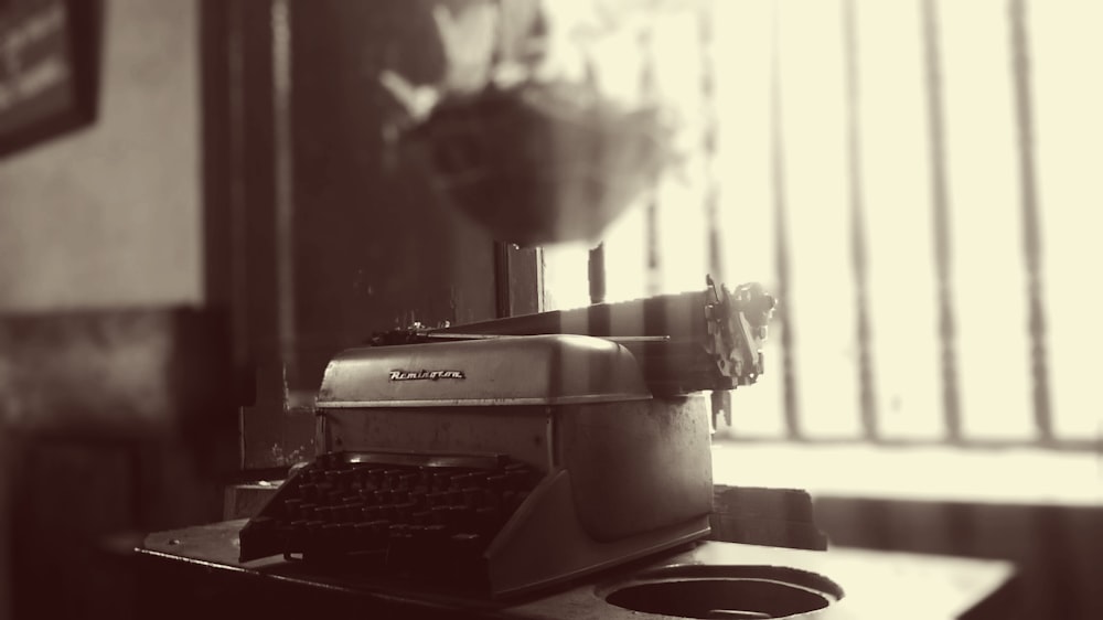grayscale photo of Remington typewriter