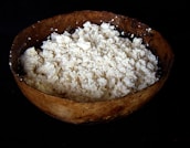 Close-up of fresh dairy products on a rustic wooden table.