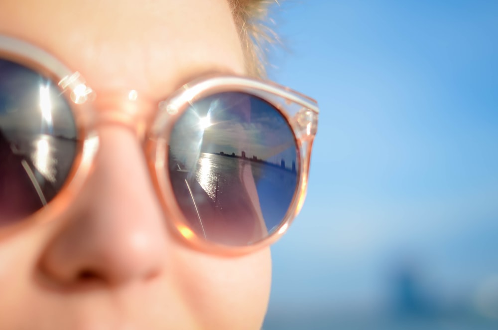 woman wearing brown framed sunglasses