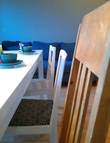 A dining area showcasing a beautiful table and chairs.