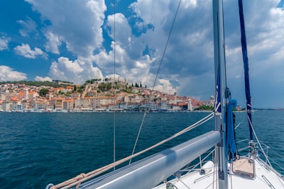 white and grey boat on sea at daytime croatia teams background
