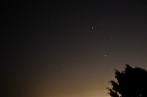 A night sky with scattered stars hinting at future stories.