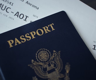 passport booklet on top of white paper