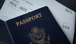 passport booklet on top of white paper