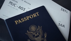 passport booklet on top of white paper